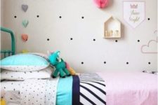 24 install a pegboard next to the bed to decorate the wall in a creative way and place some favorite toys