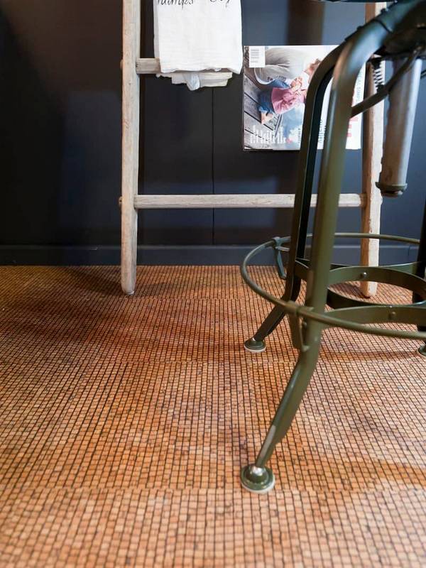 cork flooring adds interest and brightens up a dark space