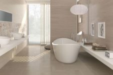 26 modern taupe bathroom with walls and floor in that color, filled with light
