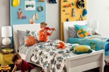 26 pegboards of different colors over beds will show each kid’s space and differentiate the beds