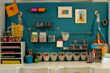 27 crafting and drawing station with a blue pegboard for comfy storage