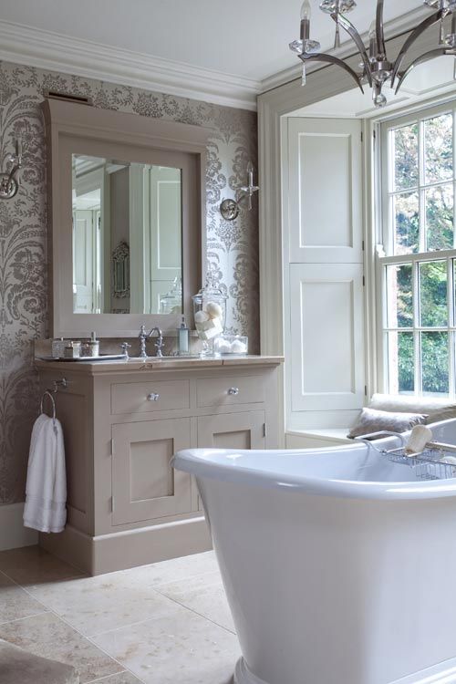 taupe and silver wallpaper and a taupe washstand look refined