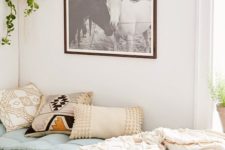 27 tribal print pillows, some greenery and a horse picture to make the room boho