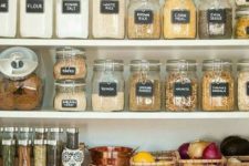 28 labeled organized pantry with glass jars and baskets of various kinds