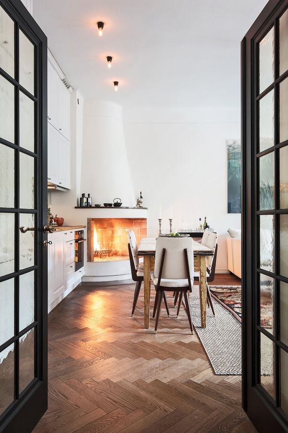 beautiful chevron-clad wooden floors make this space livelier and cooler