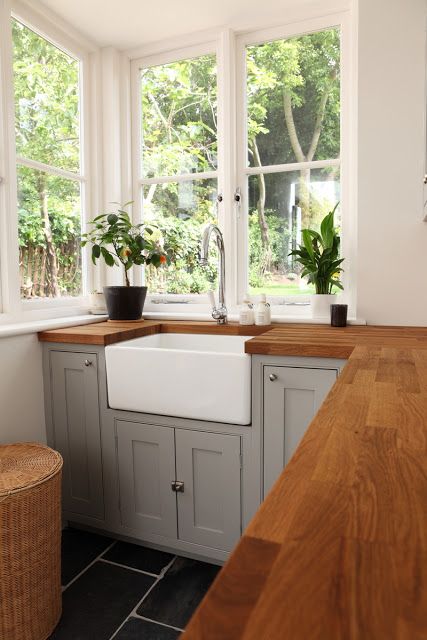 light grey cabinets and stained butcher block countertops