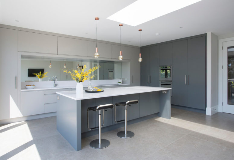 Yes, taupe interiors could be slightly cool if add lots of blue-gray surfaces to them. This modern kitchen is a great example of that. (Newcastle Design)