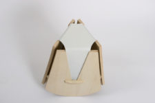 01 The Geometric Stool is a unique piece made of light-colored wood and leather with a creative modern design
