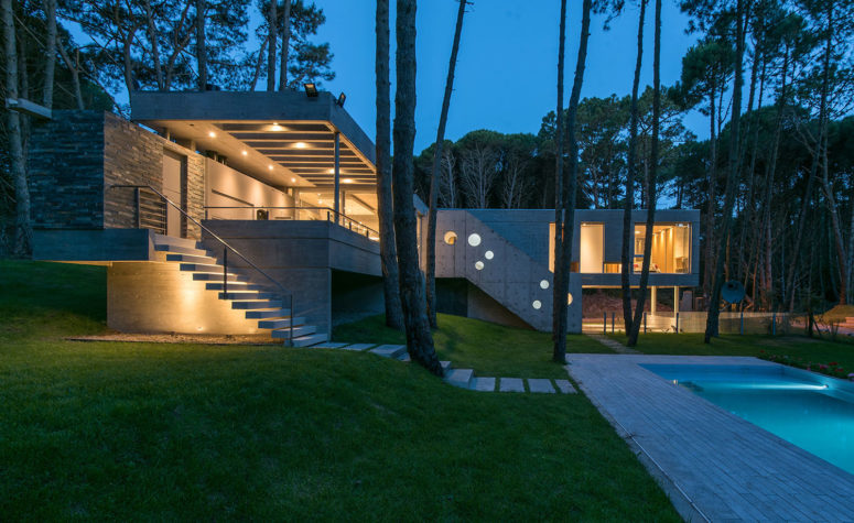 This industrial home was built with respect to the natural landscape around and connected to it