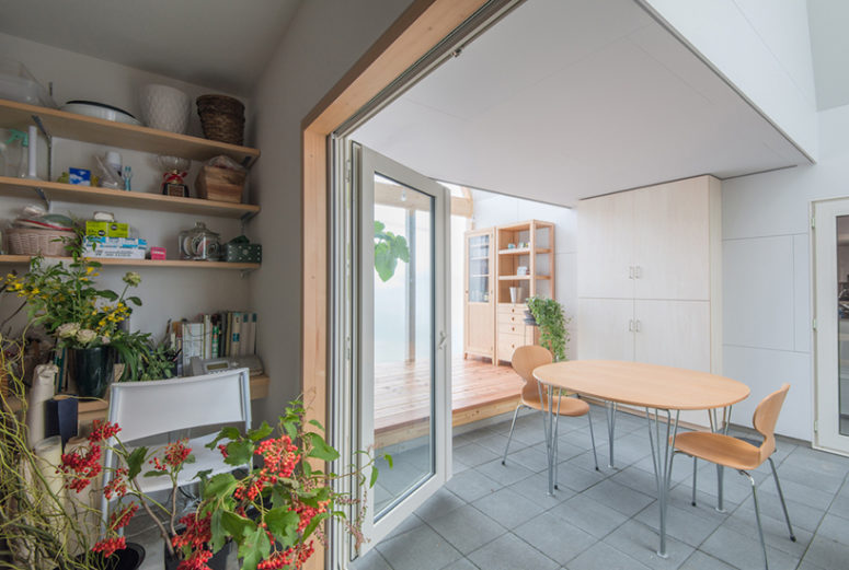 tiled floor The interiors are modern and simple, made with the use of light-colored wood and practical floor tiles