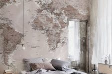 03 industrial bedroom design with a headboard wall covered with a world map