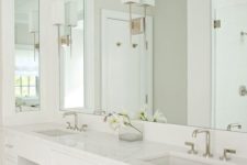 04 a mirror takes the whole wall with countertops and visually expands the space