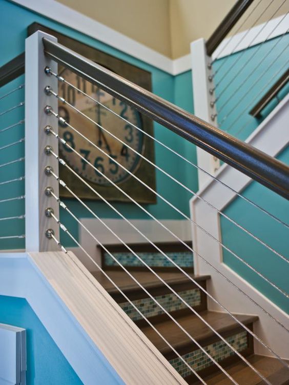 a powder-coated aluminum stair rail system visually expands the home's usable space