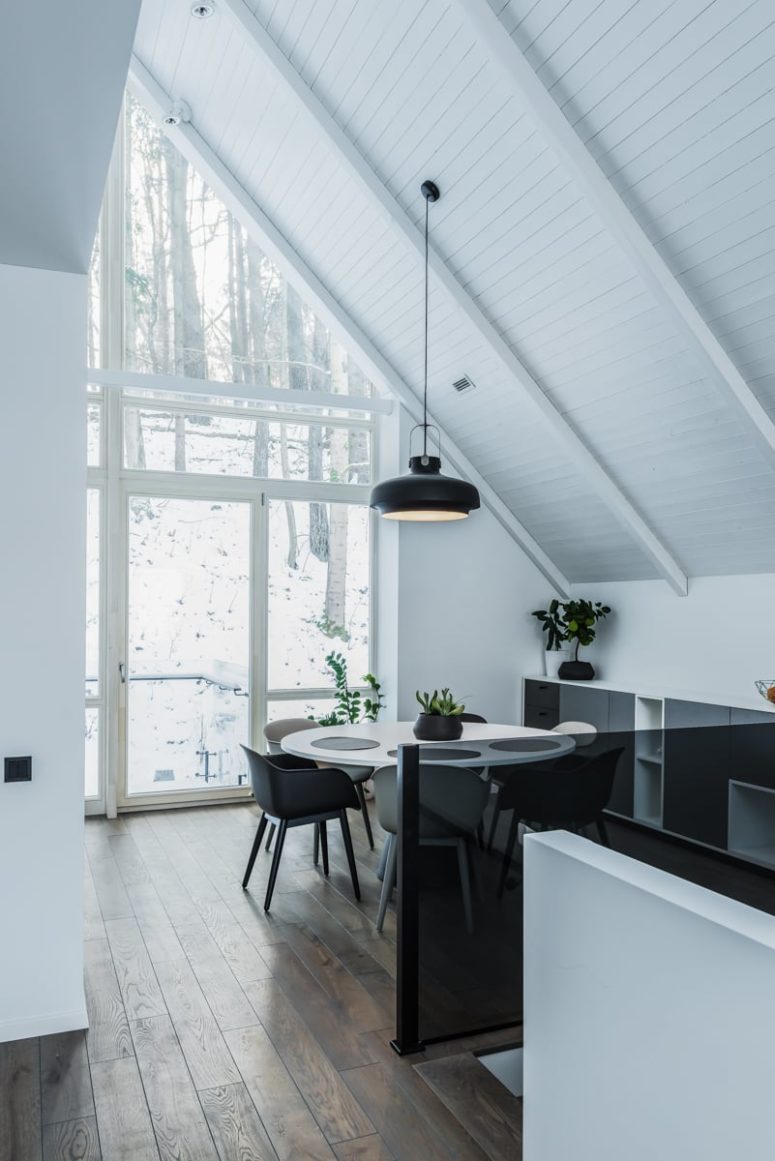 The dining area is here, by the large window, and there's additional storage by the wall