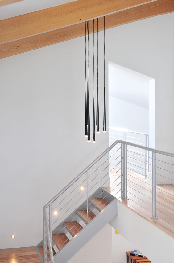 aluminum and stainless steel cable railing for a minimalist space
