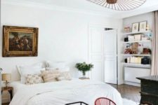 07 The bedroom has a relaxed feel and cool artworks make it more refined and chic