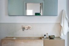 08 The bathroom is modern and functional like the kitchen but a stone sink and a jute chair bring that light Moroccan flavor