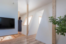 08 White walls are softened with light-colored wooden floors and window framing
