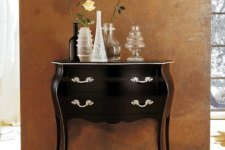 08 dark wood dresser with shining metal handles and lots of vases on display