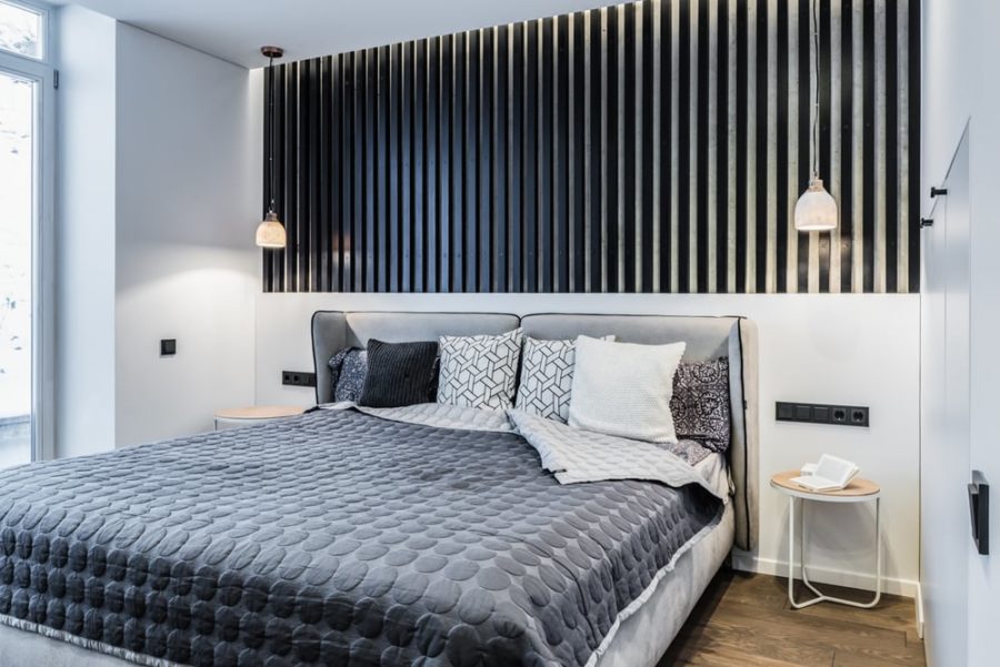 Black wood feature wall defines the whole bedroom look, it's just fantastic and perfectly matches all the rest