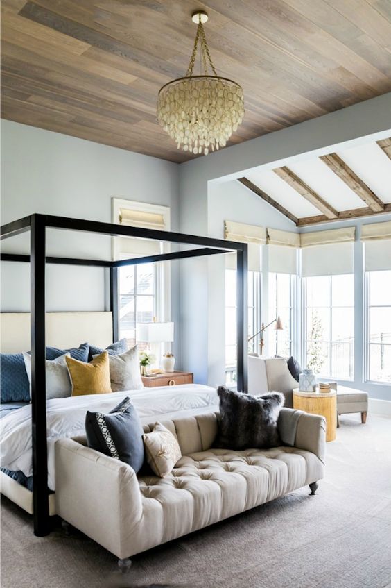 dark wood frame bed for a modern neutral and cozy bedroom to stand out