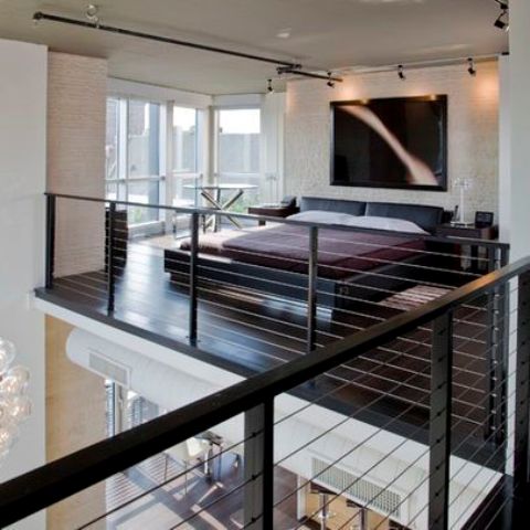 blackened steel posts, wood and cable railings that look unobtrusive