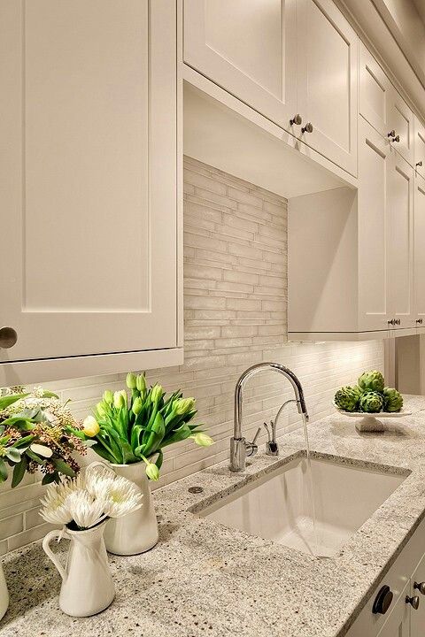 white cabinets look great with such stone-inspired grey countertops