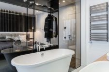 11 The bathroom is behind a glass partition, which is an interestig solution