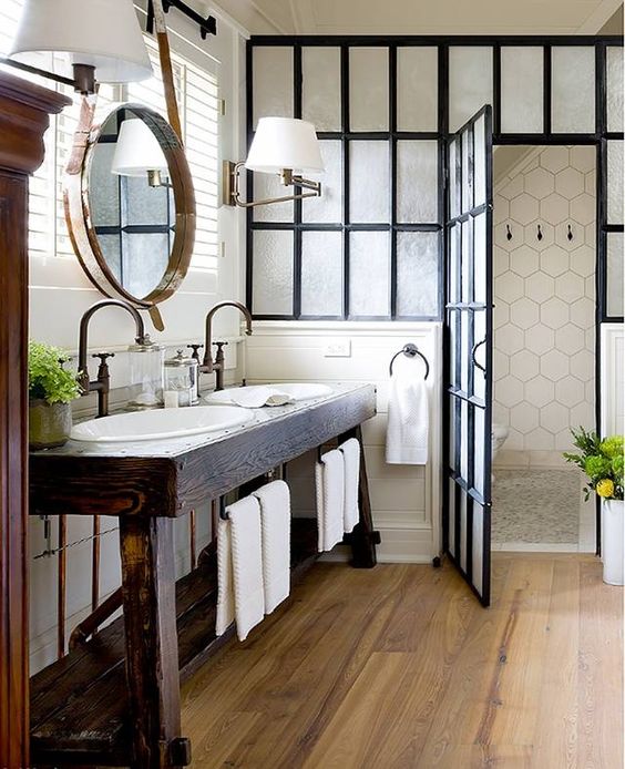 dark stained reclaimed wood vanity with an open shelf has also a rustic feel