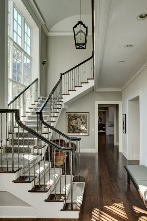 traditional stairs with a gorgeous wrought iron balustrade