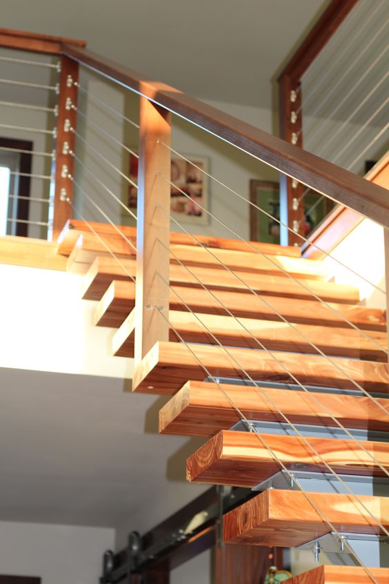 combine the modern sleek look of cable railing with a wood and stainless steel baluster for a fully-customized look