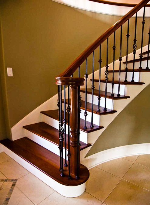 wrought iron makes any staircase look very expensive and chic
