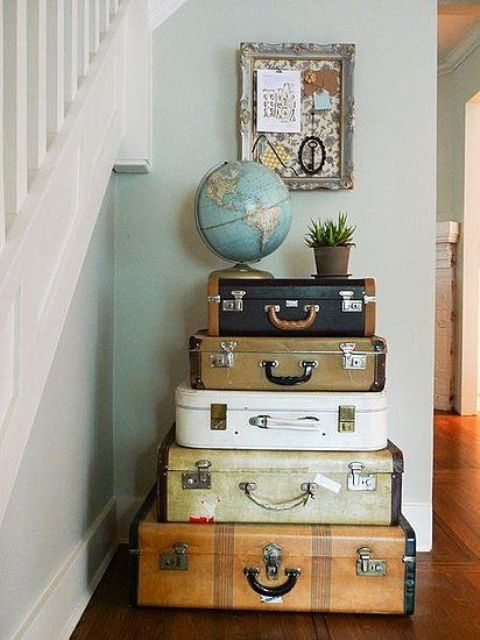 vintage suitcases stacked in your entryway can be not only a source of inspiration but also creative storage