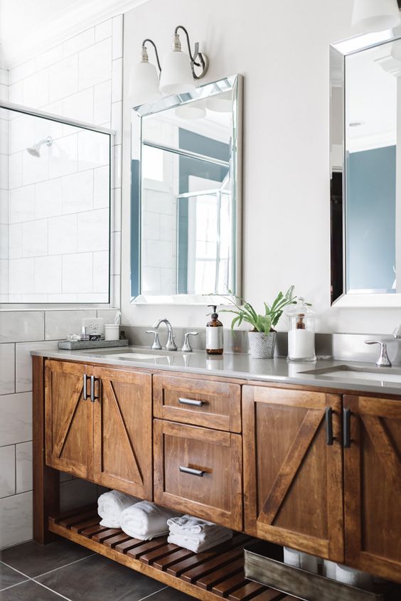 warm stained bathroom cabinetry and an open shelf underneath