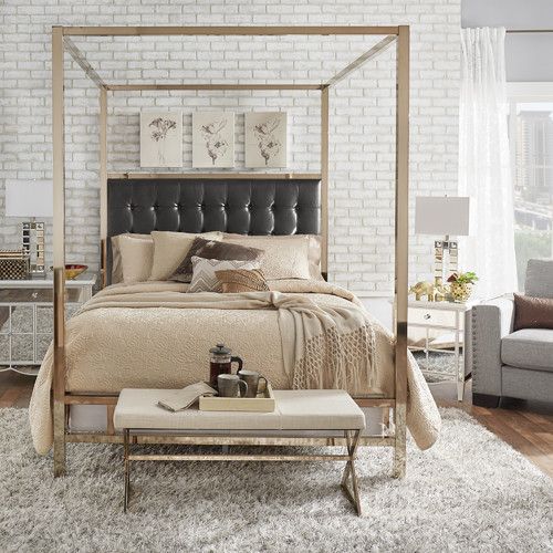 shiny metallic canopy bed with just a frame