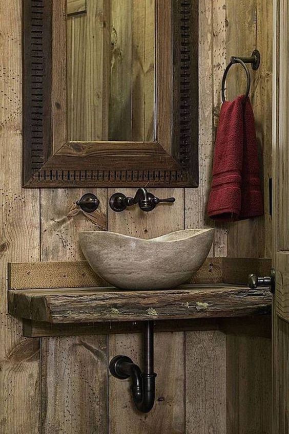 rough wood countertop and a stone sink make a cool combo