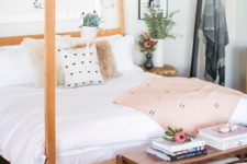 17 sweet girlish bedroom in blush with a light-colroed warm wood bed and planters hanging from the frame