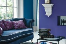 18 a violet and a teal wall, a teal sofa for a colf refined living room