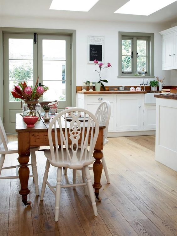 rustic kitchen and diner with a vintage dining table and chairs
