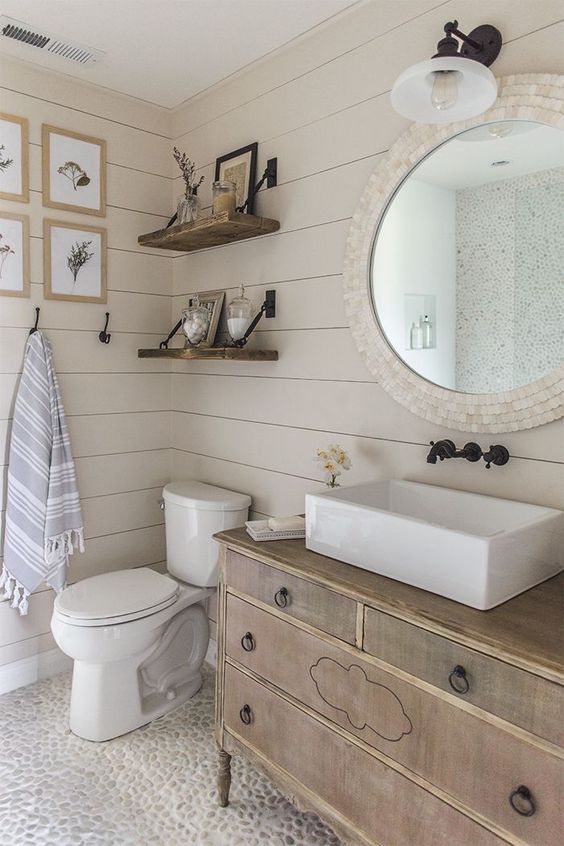 vintage sideboard repurposed into a bathroom vanity