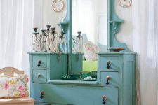 19 aqua-colored dresser used for accessory storage
