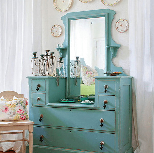 aqua-colored dresser used for accessory storage