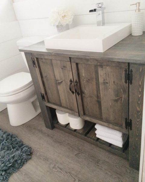 rustic bathroom cabinet with doors and an open shelf