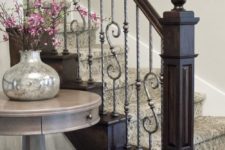 21 dark stained wood and very light wrought iron balustrade