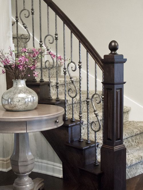 dark stained wood and very light wrought iron balustrade