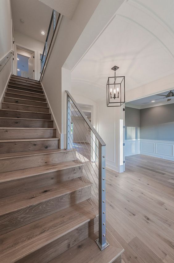 steel cable railing staircase looks very modern and edgy yet cozy and natural