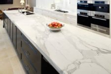 24 modern white kitchen cabinets and a black kitchen island with chic white quartz countertops