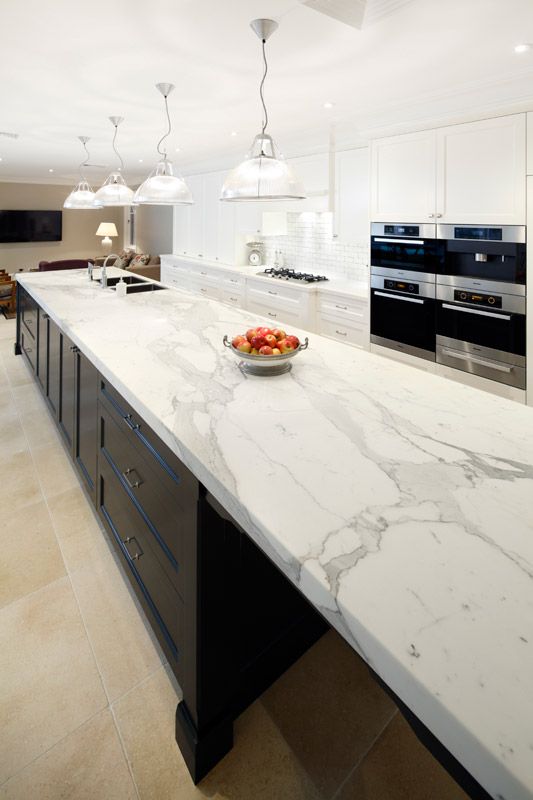 24 modern white kitchen cabinets and a black kitchen island with chic white quartz countertops