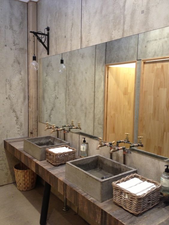 reclaimed wood countertop with concrete sinks and baskets