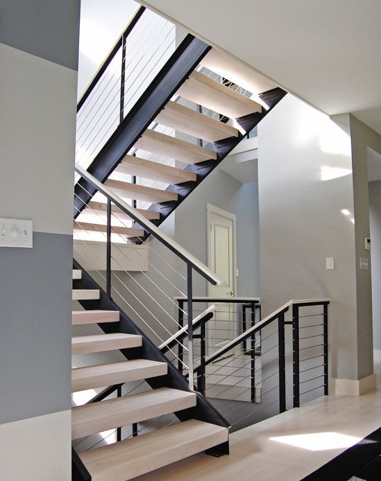 modern whitewashed and dark wood staircase with white cable railing looks wow